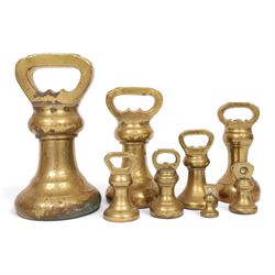 Graduating set of brass bell weights