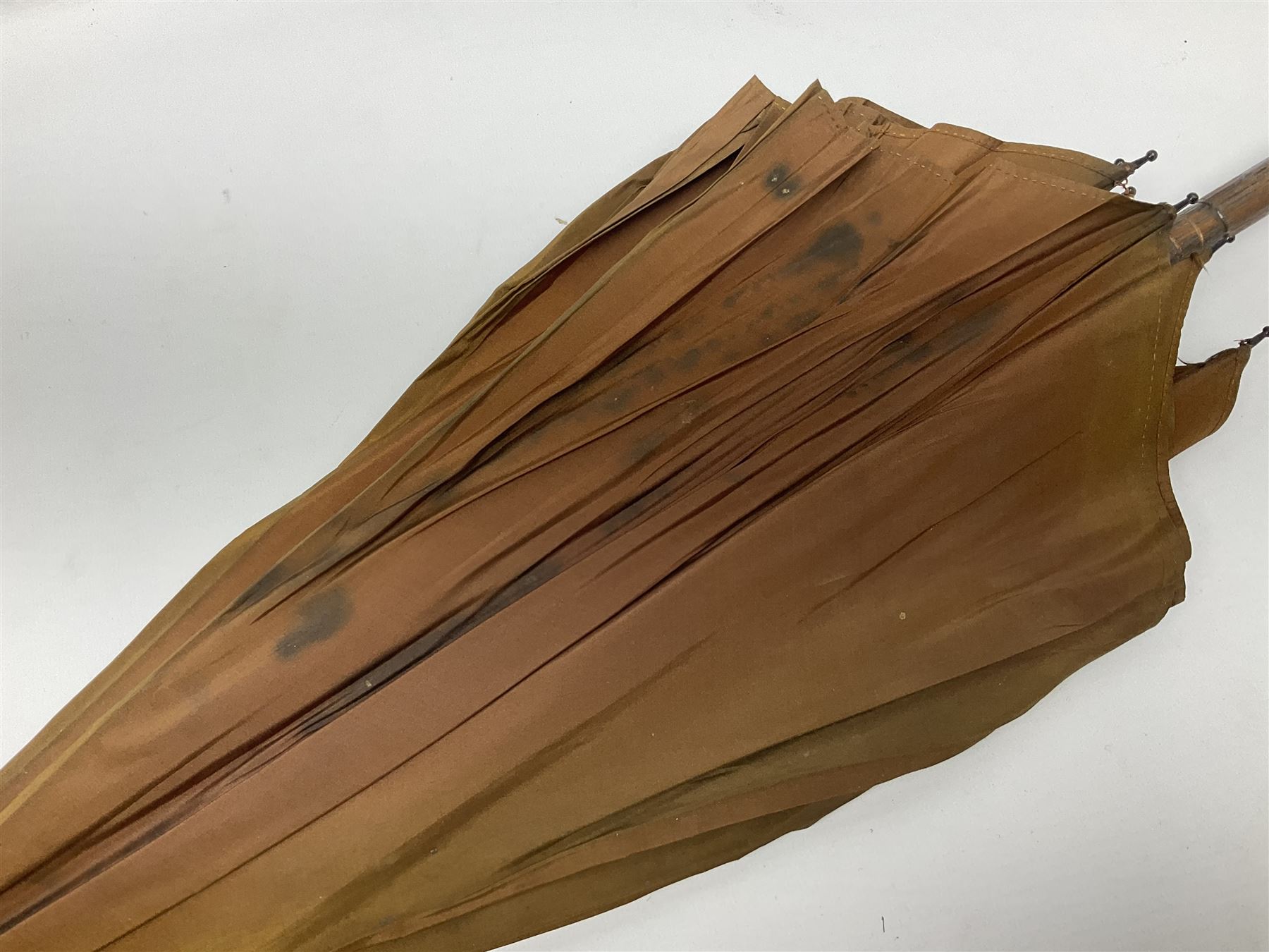 Edwardian novelty parasol by Briggs of London, the bamboo shaft with brown fabric canopy, and silver mounted terminal concealing a silver mounted pencil, hallmarked Charles Henry Dumenil, London 1904, also marked Briggs, H93cm