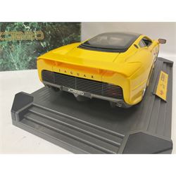 Two Maisto 1:12 scale Jaguar XJ220 ‘Racing’ cars in yellow, both on plinths in original boxes 