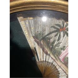 18th century fan, the horn sticks and guard with silvered and gilded decoration, the silk leaf painted in strong colours with a young couple in a garden setting, within a border of gold coloured sequins, framed and glazed, overall H35cm L55cm
Provenance: From the Estate of the late Dowager Lady St Oswald
