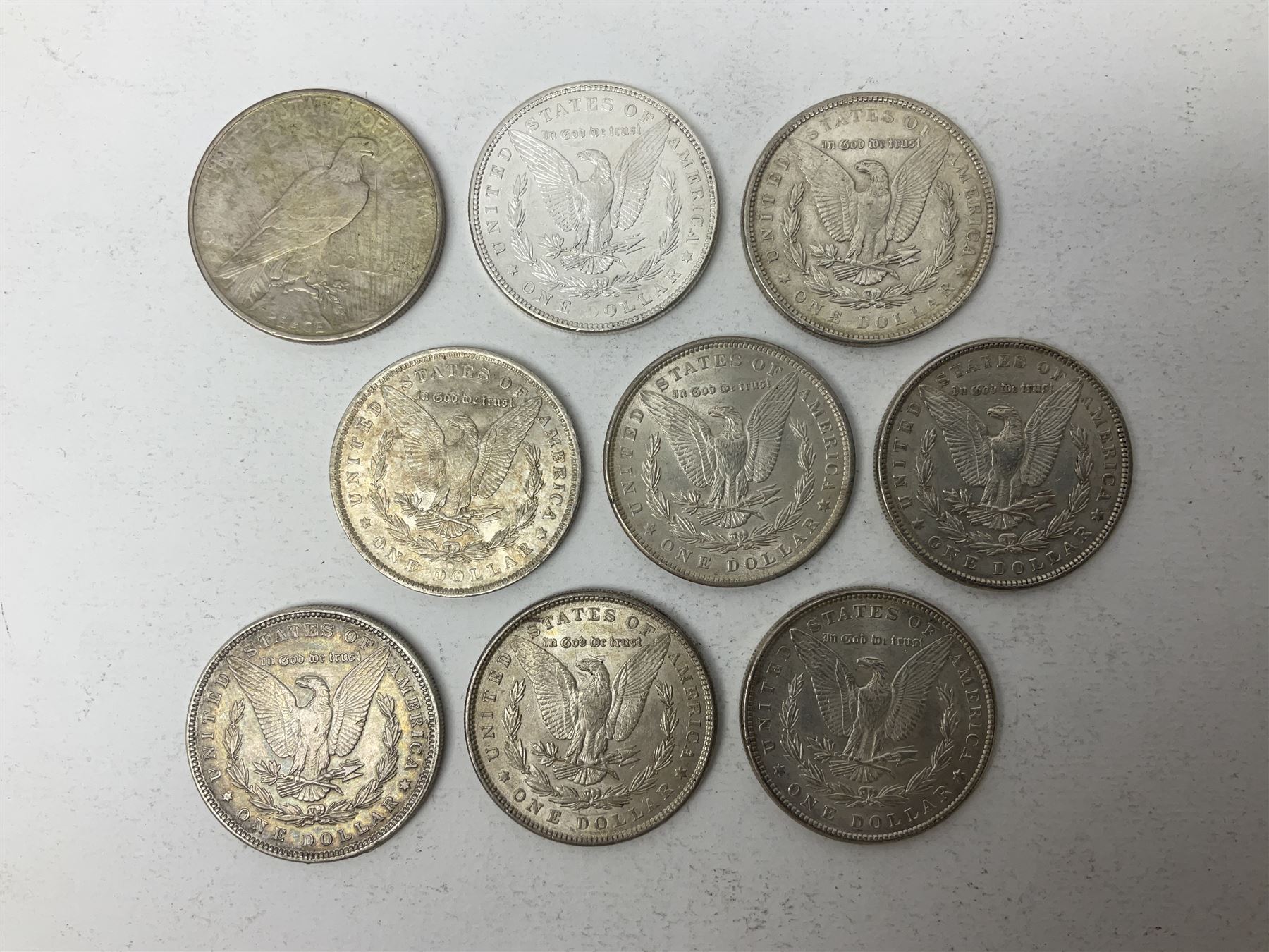Eight United States of America silver Morgan dollar coins, dated 1882, 1884 O, 1884, 1885, two 1886, 1889, 1890 and a 1925 peace dollar