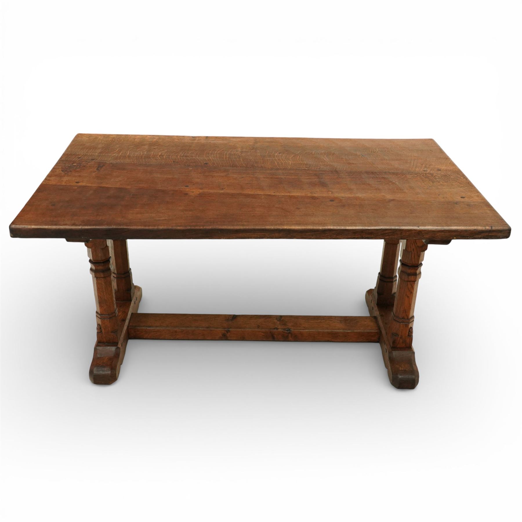 Mouseman - 1937 refectory table, Sir Herbert Baker commission for Westminster Church House, the rectangular adzed plank top above twin octagonal baluster supports united by a pegged stretcher, raised on shaped sled bases carved with a partridge and a loaf of bread, with carved mouse signature to inside leg, by Robert Thompson of Kilburn

The carved loaves reference the original patron, while the partridges are thought to represent Frank Partridge, Bishop of Portsmouth from 1877 to 1941, who played a key role in the founding of Church House and served as its Secretary from 1936 until 1941

Reference
Christie’s ROBERT “MOUSEMAN” THOMPSON; Refectory Table, Lot 188, sold at Christie’s London, commissioned by Sir Herbert Baker KCIE, RA, architect of Church House (opened 1937). Provenance and description available on the Christie’s website
https://www.christies.com/en/lot/lot-4618786