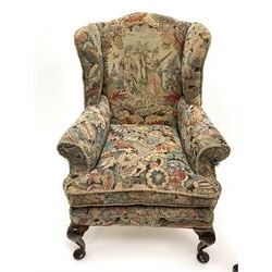 Matched pair early 20th century Queen Anne style wingback armchairs, walnut framed, sprung seats with seat cushions upholstered in needle work cover, shell carved cabriole front feet
