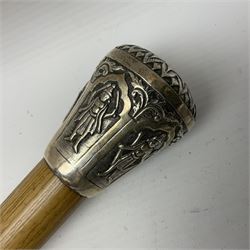 Malacca walking cane, with domed Burmese silver pommel embossed with deities, L91.5cm