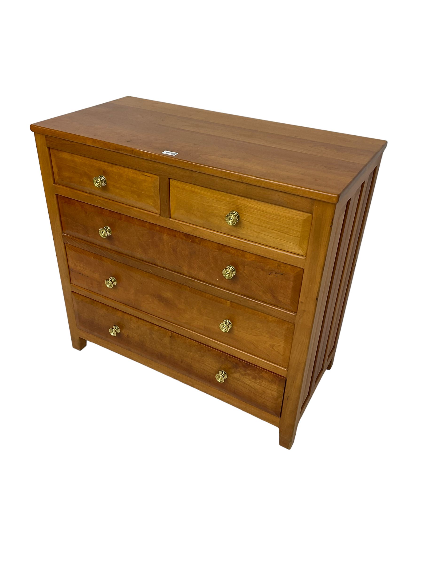 Knightman - cherrywood chest, fitted with two short and three long drawers, with panelled sides on square feet by Horace Knight workshop of Balk, Thirsk