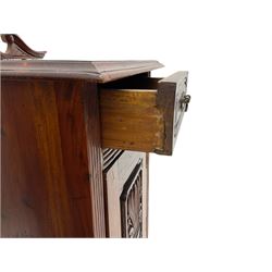 Pair Victorian style hardwood bedside cabinets, fitted with single drawer and cupboard, the doors carved with floral urns, on plinth bases