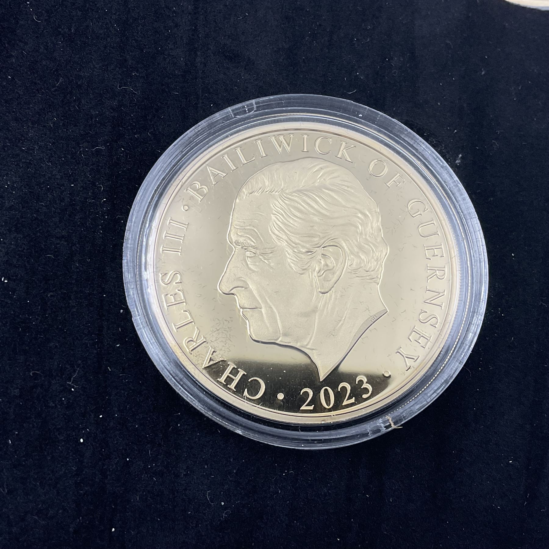 King Charles III 2023 'Coronation Silver Proof Mint Masters Set' comprising Bailiwick of Jersey, Bailiwick of Guernsey and Isle of Man sterling silver proof five pound coins, cased with certificate and Queen Elizabeth II 2019 Bailiwick of Jersey 'Remember With Us' silver two pound and five pound pair, cased with CPM certificate