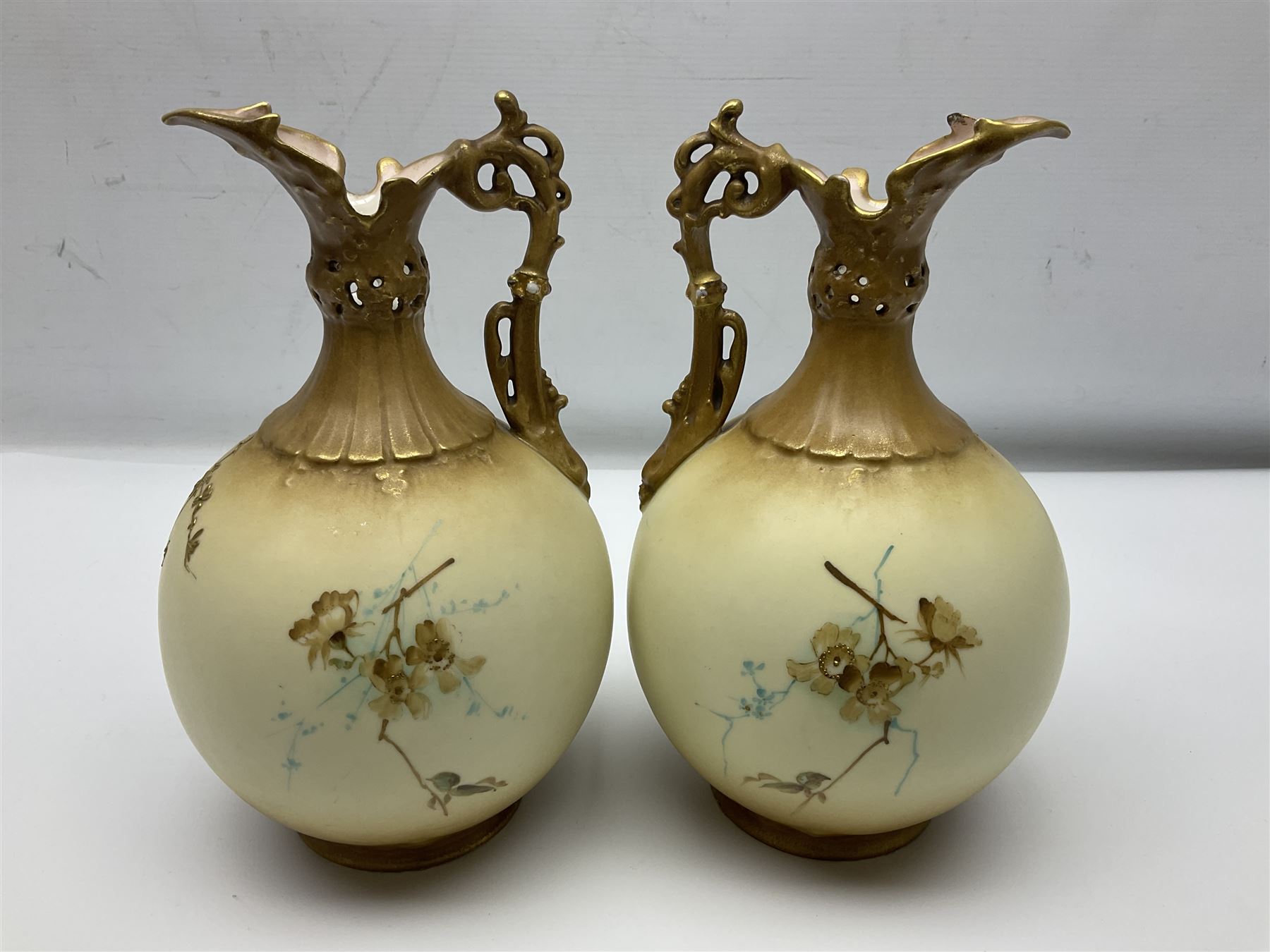 Pair of Turn Vienna blush ivory ewers decorated with floral sprays and gilt, H25cm