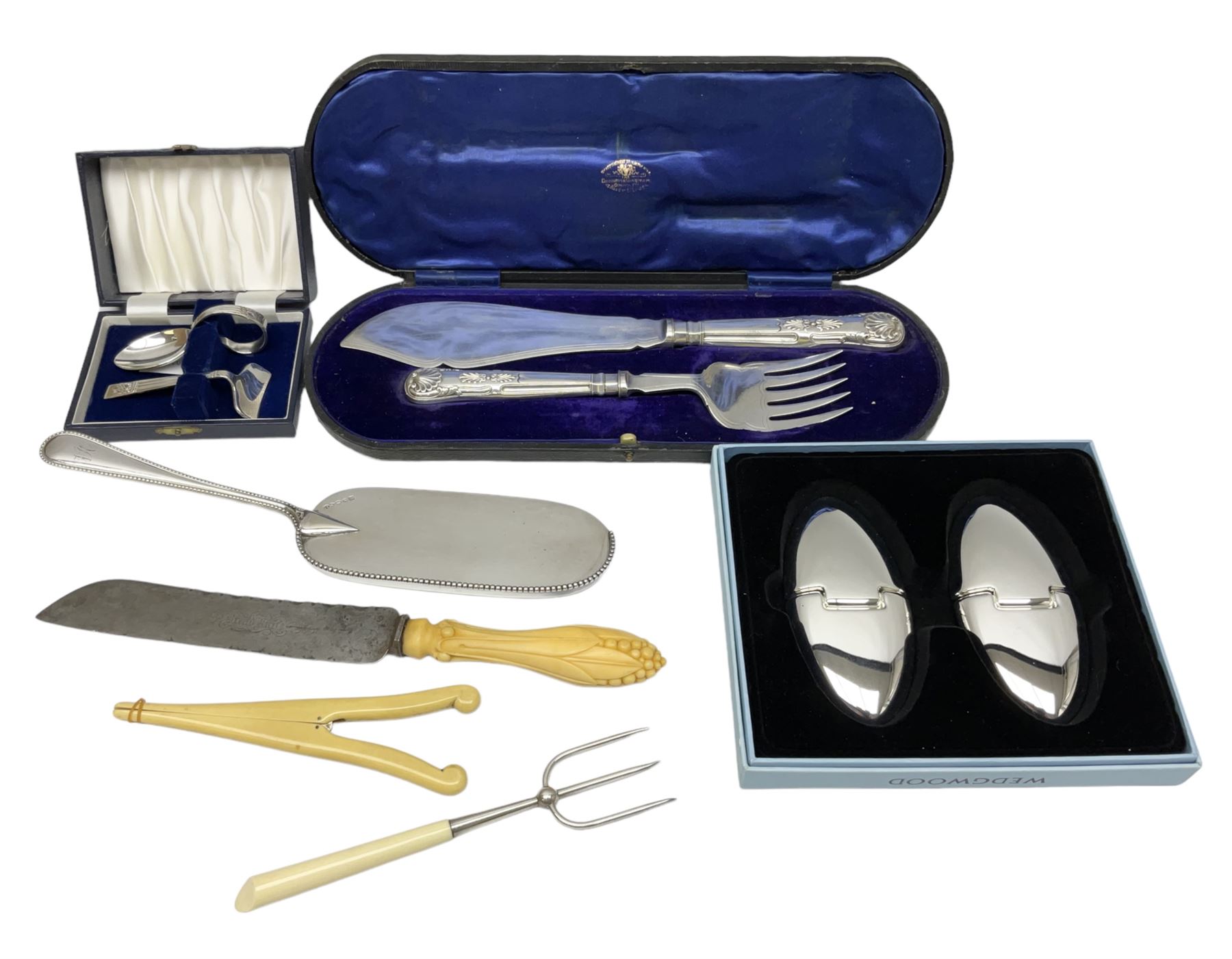 Cased pair of Wedgwood silver-plate book stands, silver-plate baby feeding spoon and pusher in box, other silver-plated cutlery