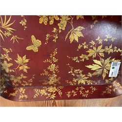 Early 19th century red lacquered papier-mâché tray by Clay of King Street Covent Garden, of rounded rectangular form, painted in gilt with large foliate sprays and butterflies, impressed verso CLAY KING ST COVENT GARDEN, W66.5cm D48.5cm