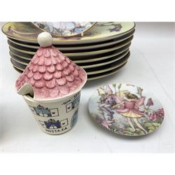 Royal Worcester Flower Fairies oval collectors plates, Goebel mustard pot, two Danbury Mint Fairy Tale bells, and pair of Hutschenreuther candlesticks decorated with scenes of Puss in Boots