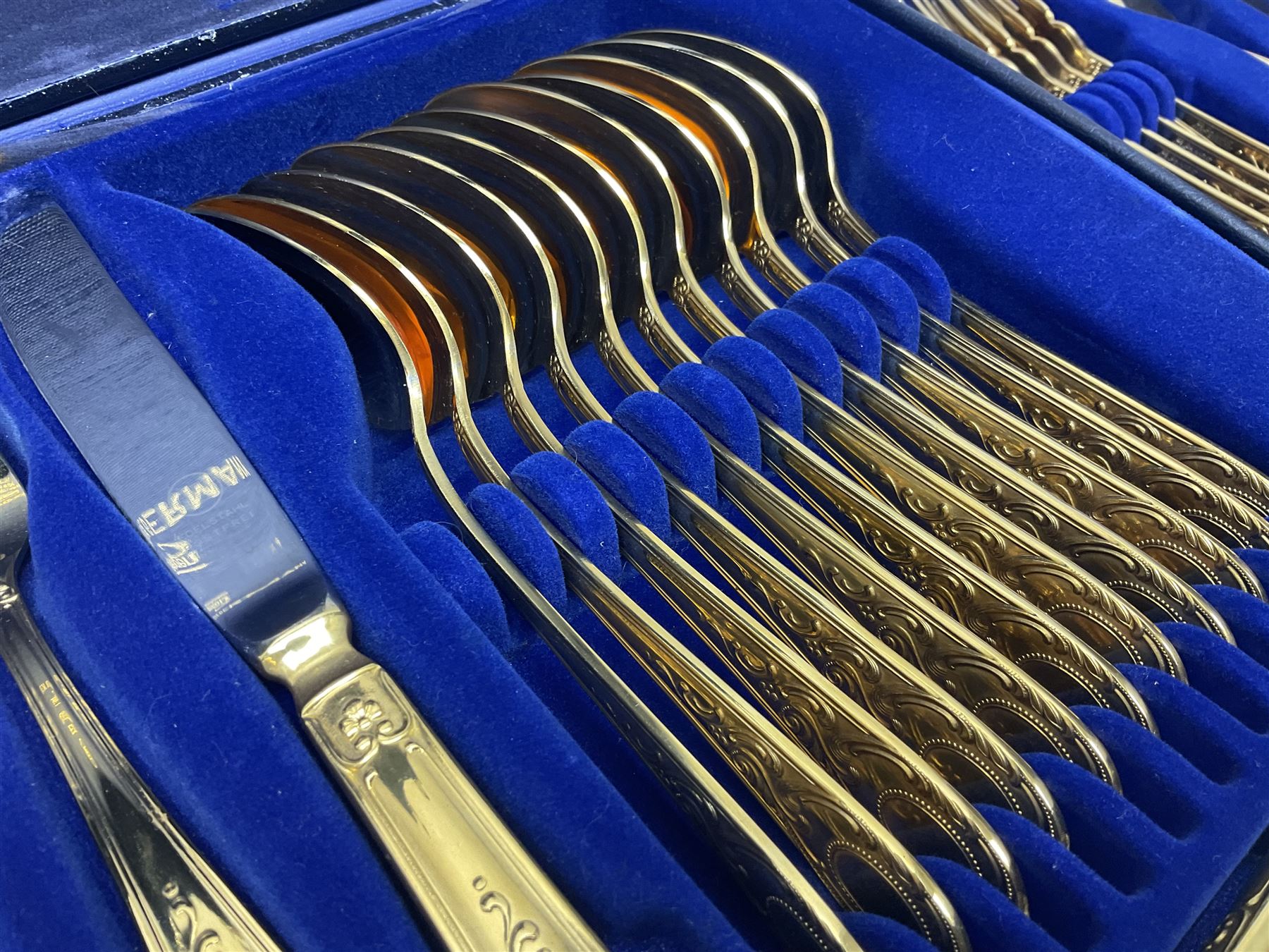 Bestecke Solingen canteen of gold plated cutlery for twelve place settings, including ladle, cake slice, fish servers, fish knives and forks, 108 pieces total, contained within a briefcase 