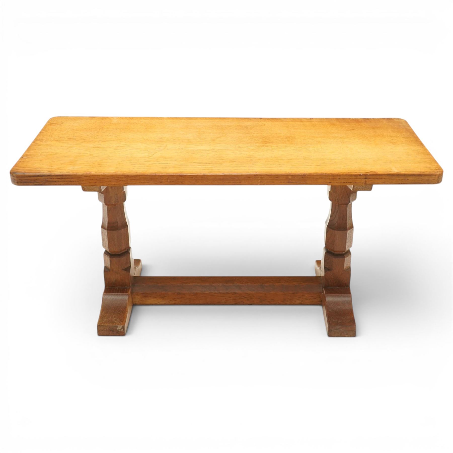 Mouseman - adzed oak rectangular refectory style coffee table, with rectangular adzed top, raised on octagonal supports united by a stretcher, with carved mouse signature, by the workshop of Robert Thompson of Kilburn