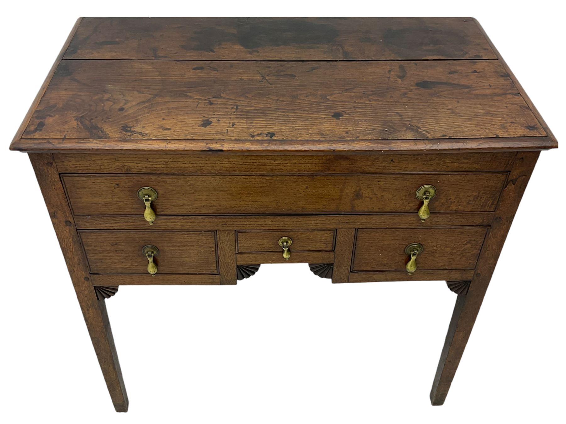 18th century Welsh oak lowboy, fitted with long drawer above three small drawers, square tapering supports, with fan carved corner brackets, circular plate and drop handles 