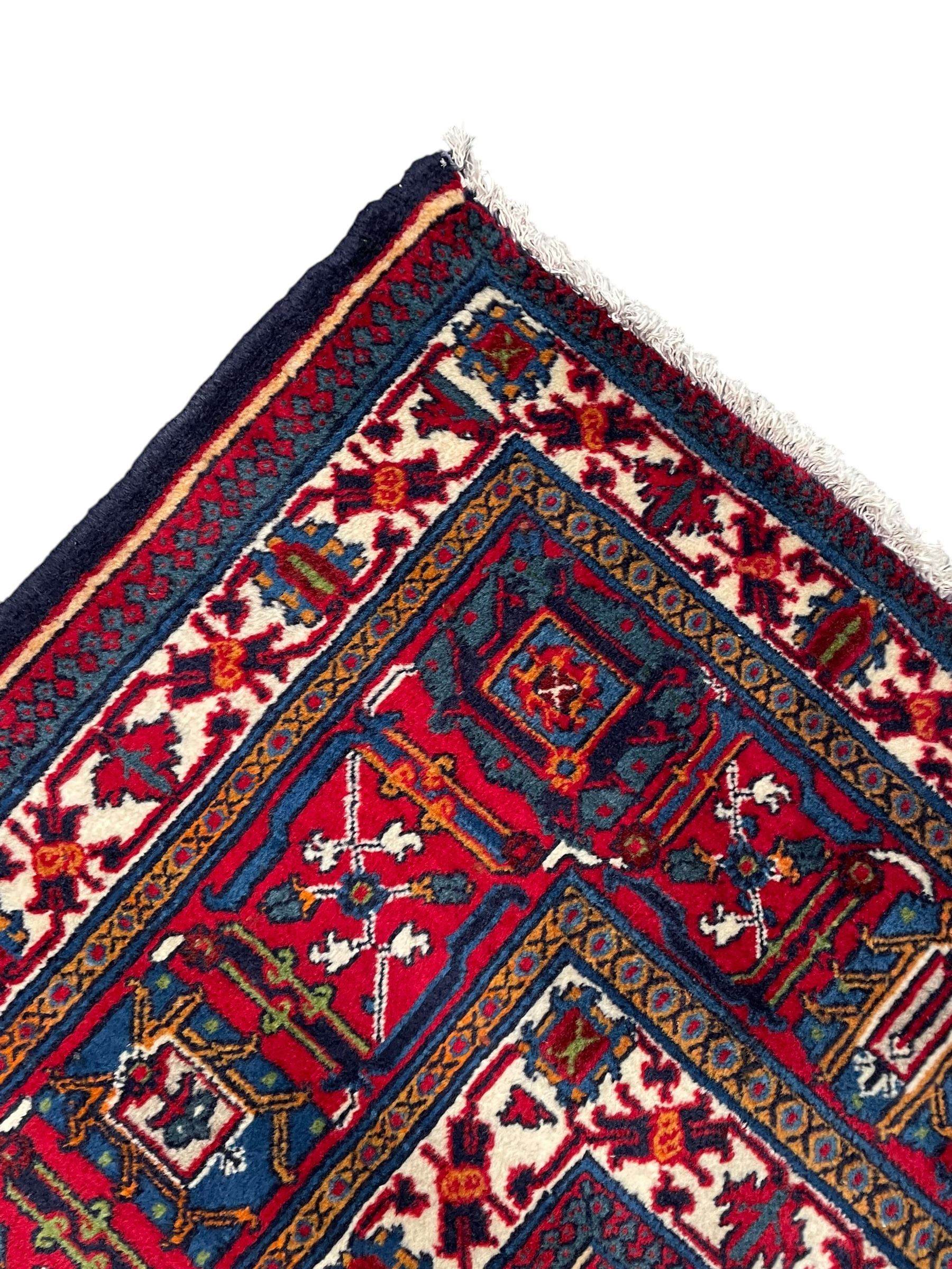 Persian Meimeh indigo ground rug, the central medallion within a field of small floral lozenge motifs, the guarded border with repeating pattern
