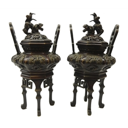  Pair 20th century Japanese bronze Koro and covers, relief decorated bulbous body, pierced covers with Dog of Fo finials on four tall cabriole legs, H29cm (2)  