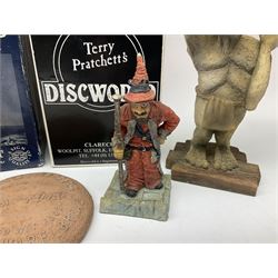 Terry Pratchett Discworld figures, designed by Clarecraft, comprising Lias Bluestone DW82, Hogfather DW72, Granny Weatherwax, boxed, DW06, Ridcully DW61and 'Ironcrust's genuine dwarf bread'.