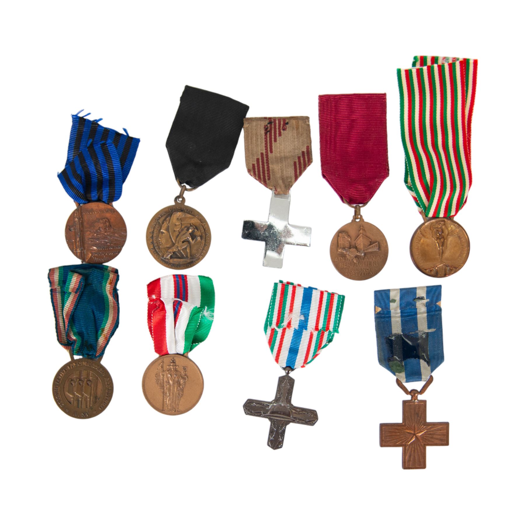 Collection of nine Italian medals, from WWI and WWII, including War Cross , Vittorio Veneto, 1914-18 war medal, Fascist GIL 2nd class, MVSN Colonial, Mussolini medal, Bersaglieri 1934 medal, Ethiopia war medal etc