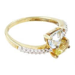 9ct white gold quartz, aquamarine and diamond crossover ring, single pear cut aquamarine and yellow / green quartz, with diamond set shoulders, Birmingham 2004