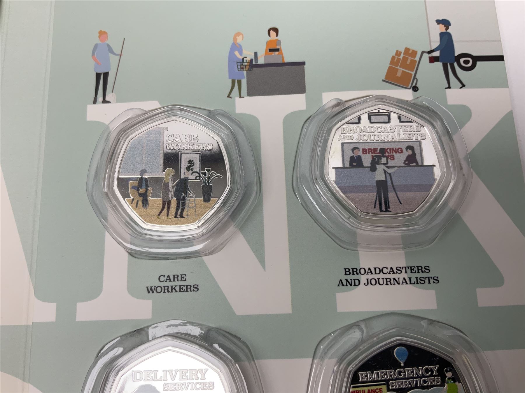'Thank You To Our Key Workers Official Charity Coin Collection' comprised of fourteen Queen Elizabeth II Samoa half dollar coins including one minted in fine silver, the others being plated, housed in the official folder