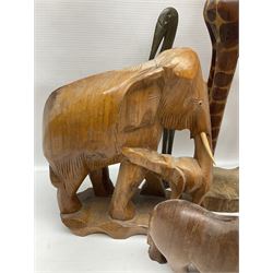 Collection of carved wooden animals, including leopard, elephants, camel etc