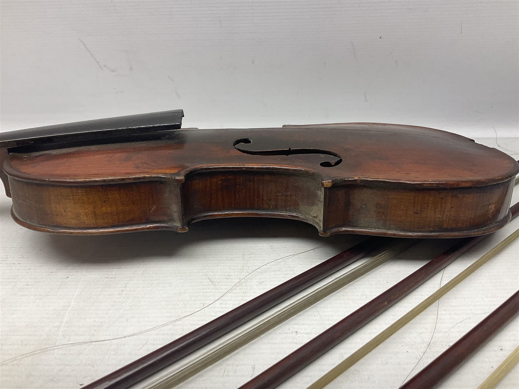 Incomplete amateur made violin c1880 for restoration and completion with 36.5cm one-piece maple back and ribs and spruce top L59.5cm; together with two brazilwood violin bows and pernambuco cello bow, all with nickel mounts (4)