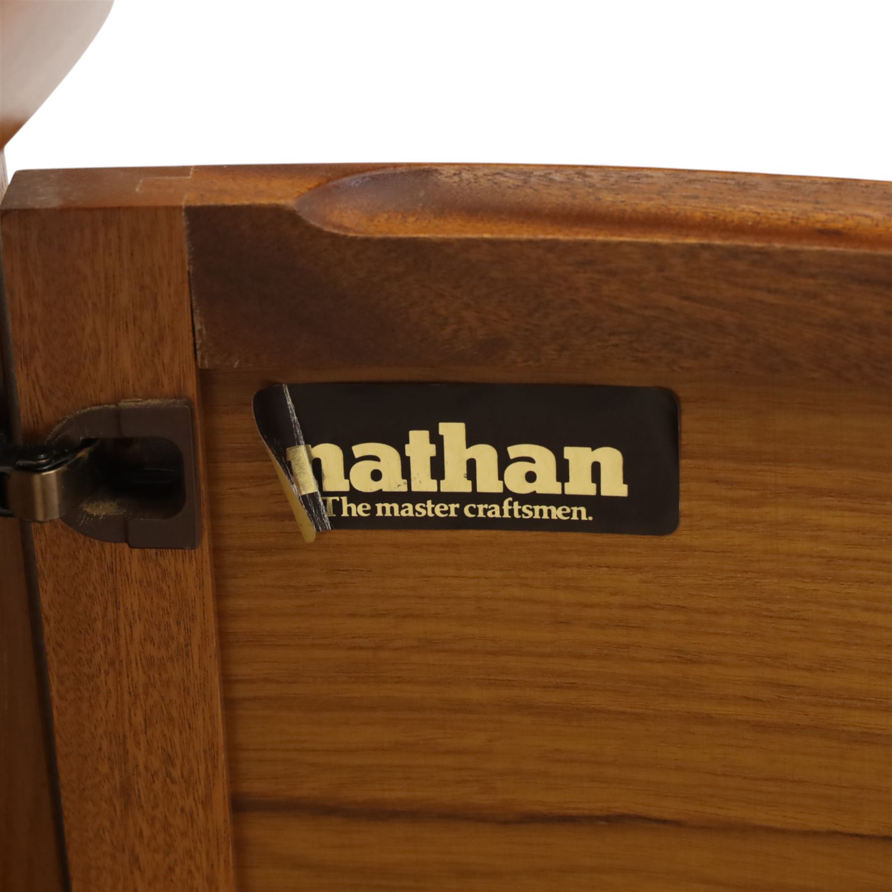 Nathan for Parker Knoll - corner cabinet, the upper section enclosed by two curved glazed doors with glass shelves, over a shaped base fitted with a single frieze drawer and panelled twin cupboard doors