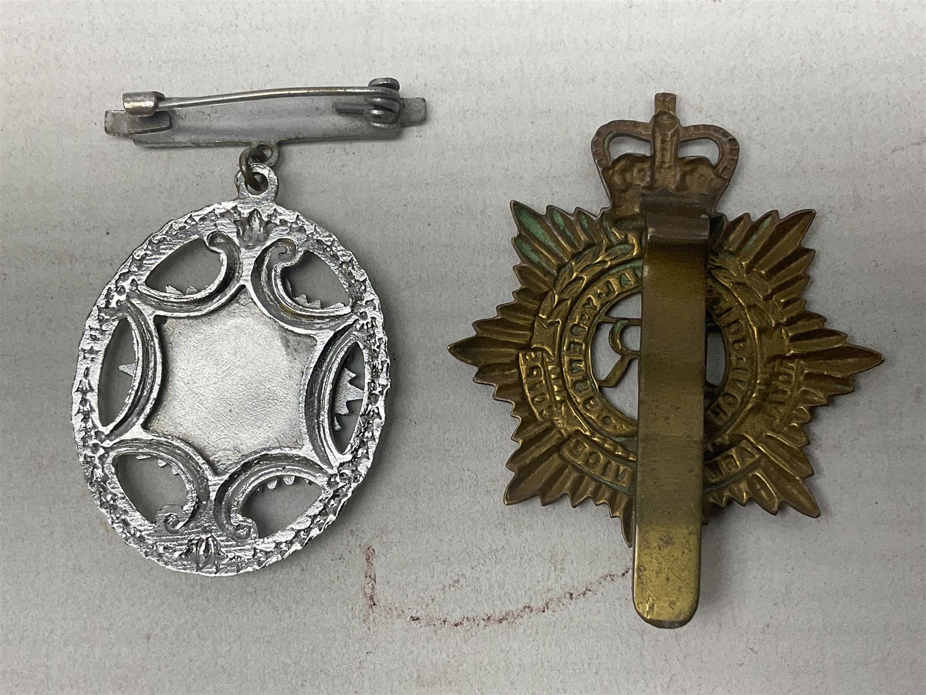 WW2 group of four medals comprising 1939-1945 War Medal, Defence Medal, Italy Star and 1939-1945 Star; with Royal Army Service Corps cap badge and RASC chrome and enamel sweetheart brooch