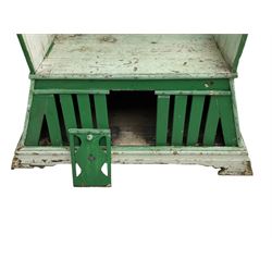 19th century painted pine hen coop settle, overhanging arched canape with dentil moulding and shaped edge, the panelled seat over a triangular platform base with removable hen-coop door, in green and white finish