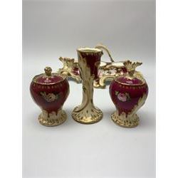 19th century desk stand, possibly Minton, of scrolling form the tray hand painted with floral spray before twin lidded inkwells flaking a central candlestick/taper stick, with pattern number beneath 6355, L21.5cm