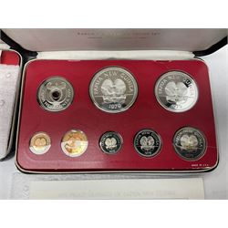 Four Papua New Guinea proof eight coin sets, from ten kina to one toea, comprising First Coinage of Papua New Guinea 1975 proof set, 1976, 1977, and 1979 proof sets, the 1977 and 1979 sets containing 925 silver ten kina and 500 silver five kina coins, all minted at the Franklin Mint, cased with certificates (4)