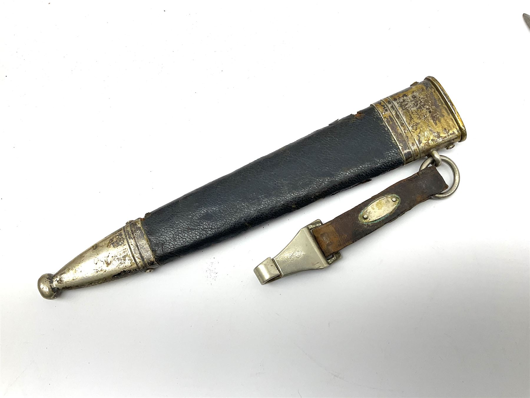  WW2 German SMF Solingen DLV flyers dagger with 16cm steel blade, nickel downswept cross-piece and pommel and leather covered grip, in leather and nickel scabbard with leather suspension strap L34cm overall. After WWI Germany was forbidden an air force by the Treaty of Versailles however the Deutscher Luftsport-Verband (German Air-sport Association) was formed in March 1933 from various sports flying clubs and had branches for aeroplane, gliding and balloon flying. Under cover of the sporting DLV, many future Luftwaffe pilots trained to fly. DLV was embodied with the NSKK in March 1935 and 1st March 1937 Luftwaffe formed.