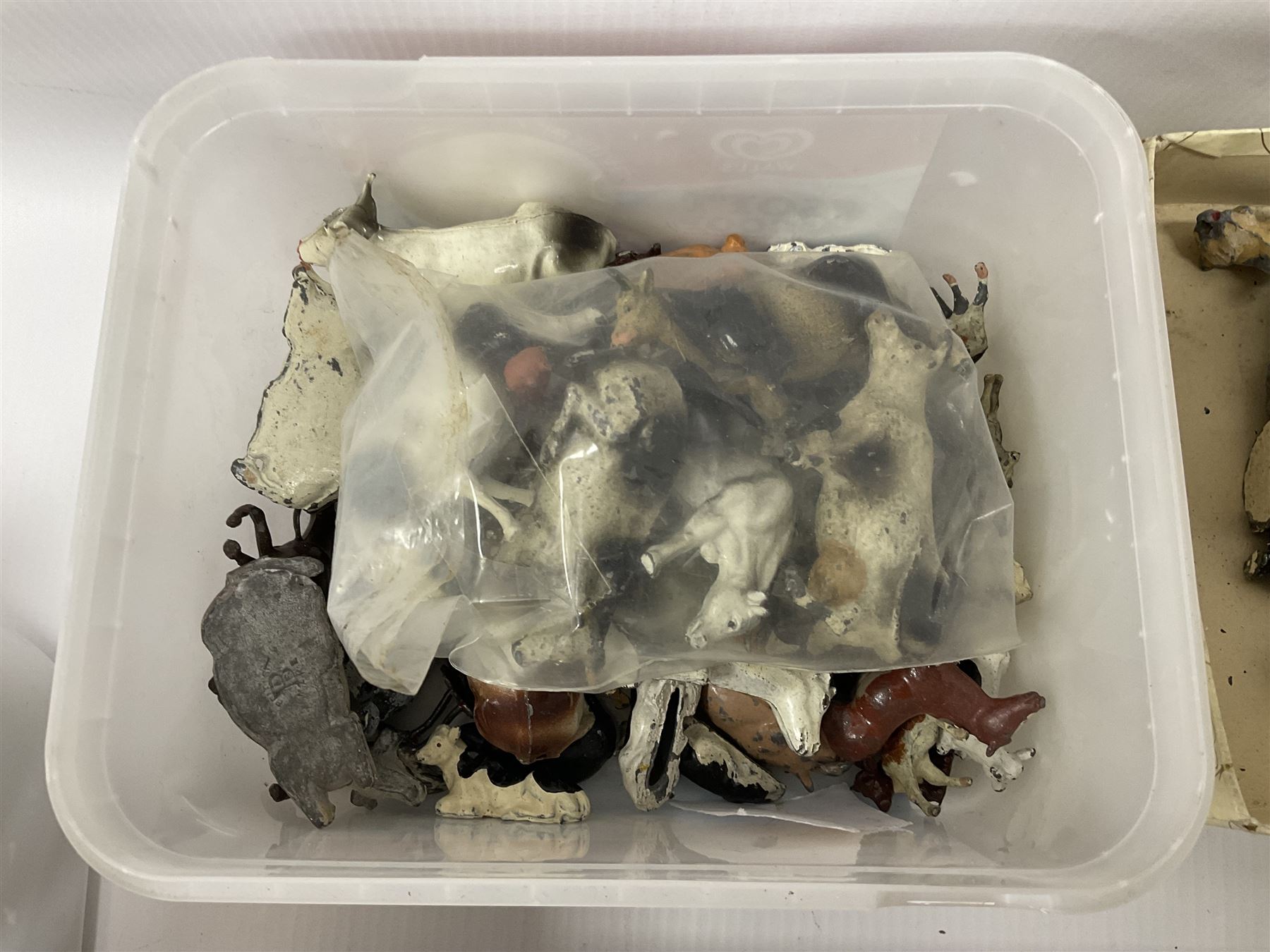 Large quantity of playworn 1950s Britains and other lead figures including farm and zoo animals, horse drawn carts, fencing etc