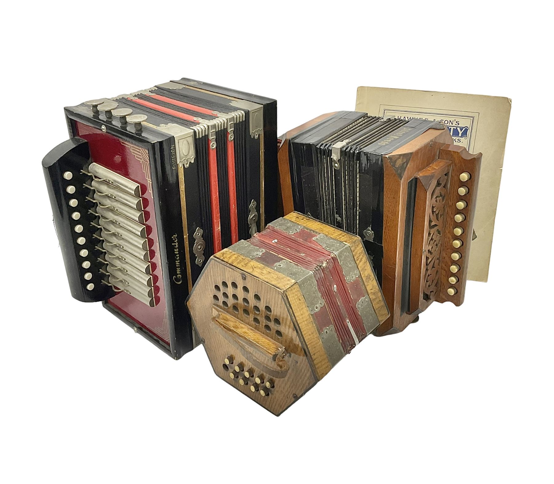 Three European concertinas, comprising Viceroy German concertina with 21 keys, hexagon wooden frame and 8 fold bellows
Oak framed concertina with 12 keys and 8 fold bellows
Commander concertina with 12 keys and 12 fold bellows
With tutor