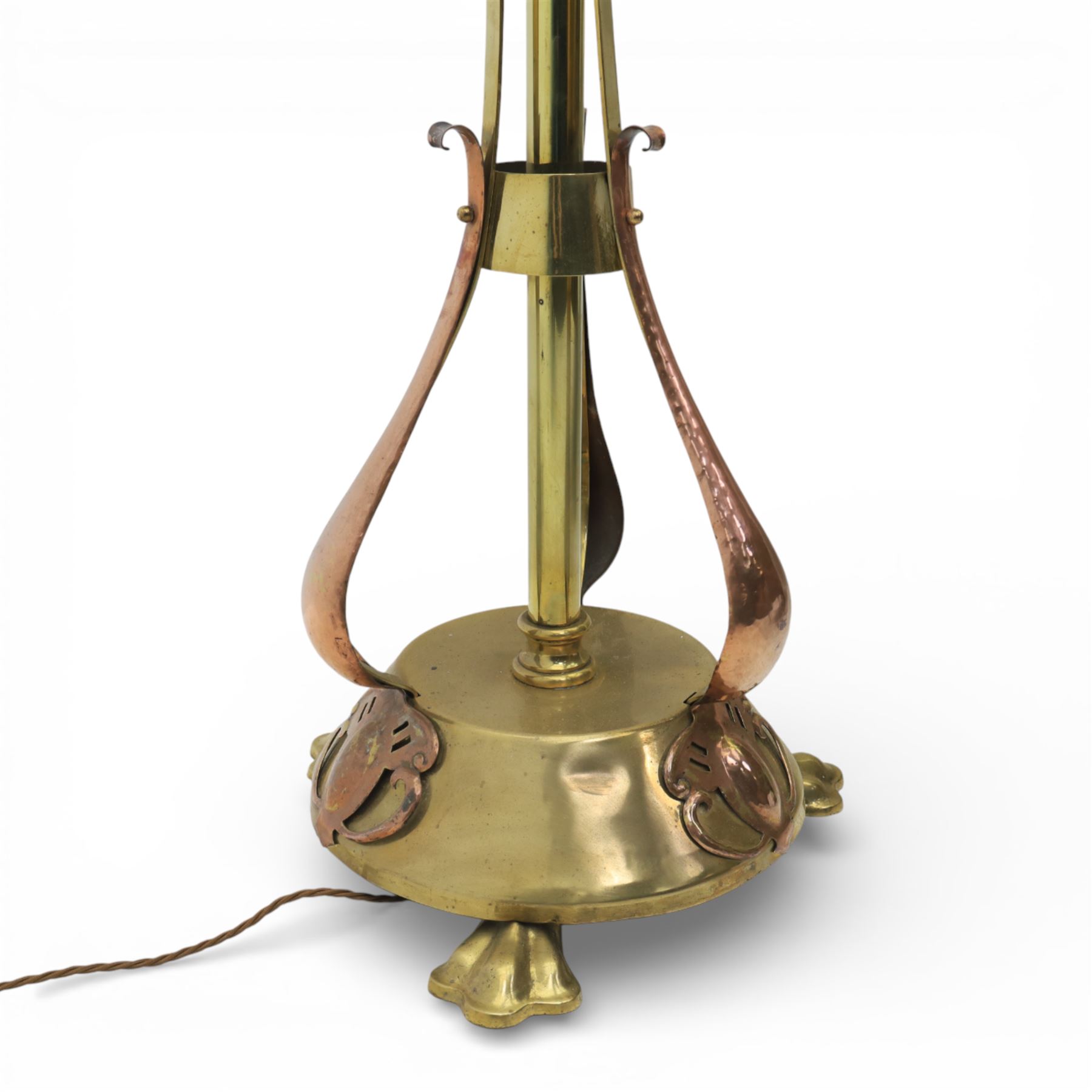 Arts and Crafts copper and brass standard lamp, in the manner of W A S Benson, slender tubular column with adjustable height mechanism, applied copper scroll brackets, circular weighted base with copper struts and stylised feet