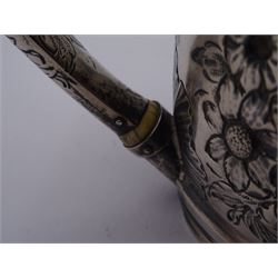 George III silver teapot, of oval form, with embossed foliate, floral and scroll decoration and engraved central cartouche, with acanthus capped C handle with ivory insulators, hallmarked John Emes, London 1807 This item has been registered for sale under Section 10 of the APHA Ivory Act
