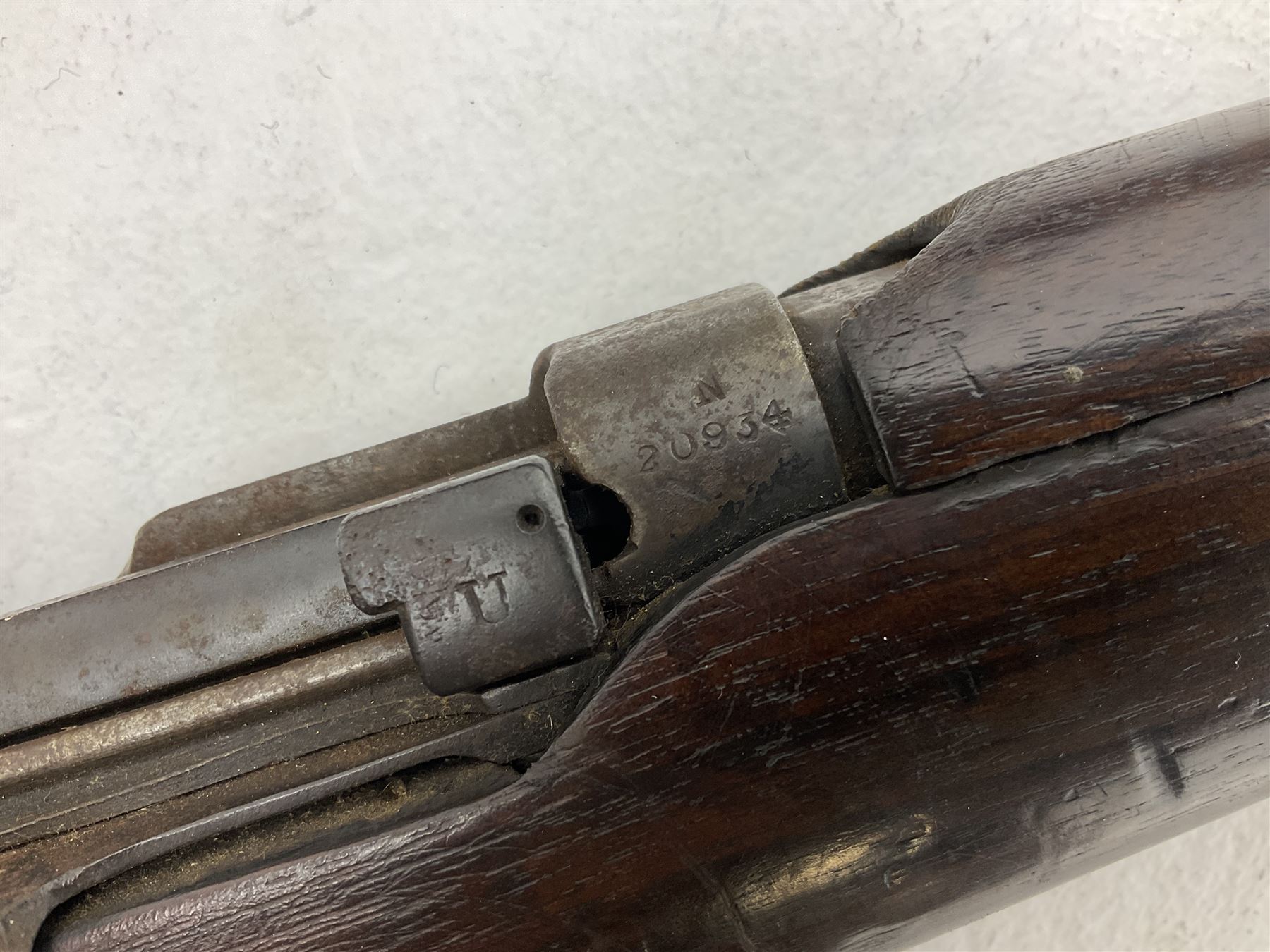 WW1 Lee Enfield SMLE .303 bolt action rifle with 63.5cm barrel and magazine; No.20934; L112cm overall; home deactivated by welding down bolt and end of barrel so requires re-deactivation to modern standards; and 19th century 12-bore double barrel hammer shotgun with 65cm cut-down barrels, non-rebounding hammers and under-lever opening, the lock-plate indistinctly inscribed G.T. Bartrant(?) L75cm overall; home deactivated by welding both barrels closed at breech so requires re-deactivation to modern standards (2) RFD ONLY 
