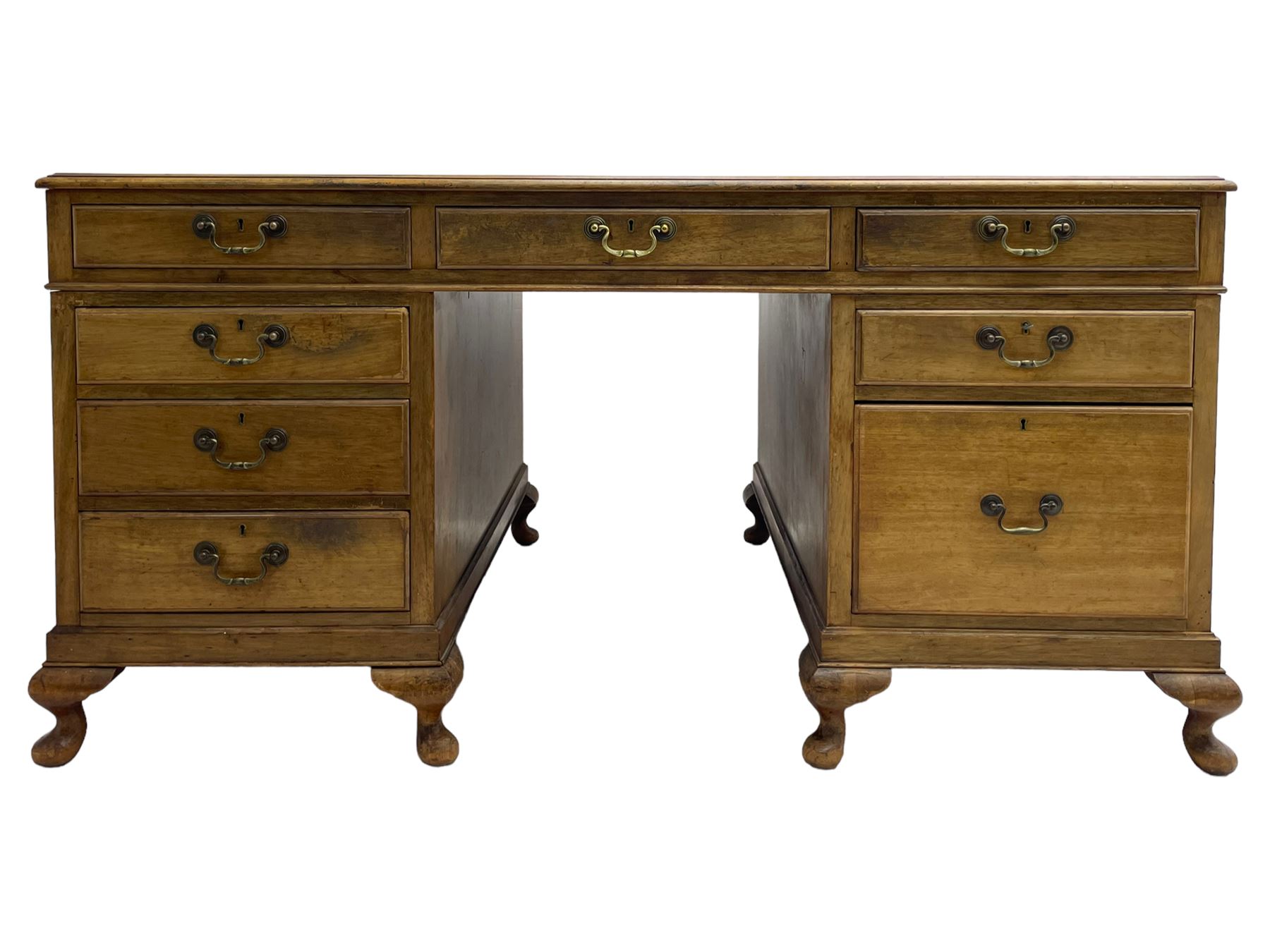 Early 20th century mahogany twin pedestal desk, the moulded rectangular top with three sectional leather insets with gilt decoration, fitted with eight drawers, on cabriole feet