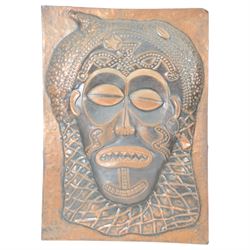 Two Copper embossed panels, the first depicting an African warrior, the second an African mask, H70cm, W50cm