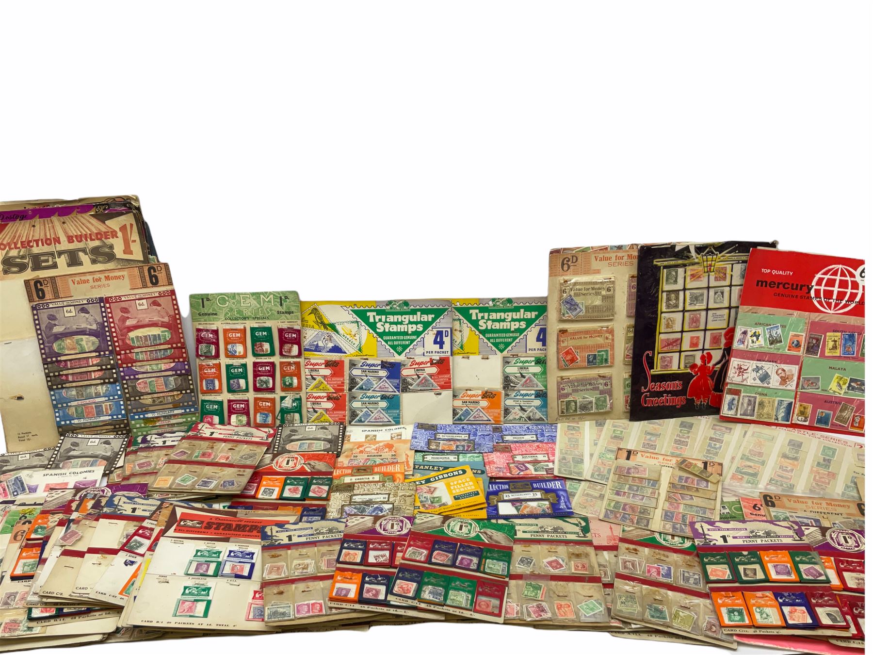 Collection of stamps including packets still mounted to the original shop cards, reading 'A Darracott Product Stamps 1d per pkt' etc, Countries include China, Spain, Argentina, Liberia, Denmark etc, in one box