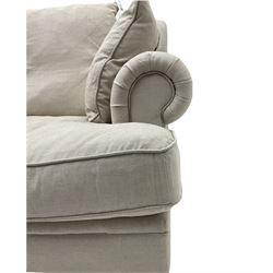 Grande four seat sofa, upholstered in natural linen, shaped back, scroll arms