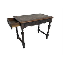 Late 19th century ecclesiastical oak side table, rectangular top witt lunette carved border and moulded edge, frieze carved with fleur-de-lis decoration and shaped apron, raised on turned supports united by stretcher