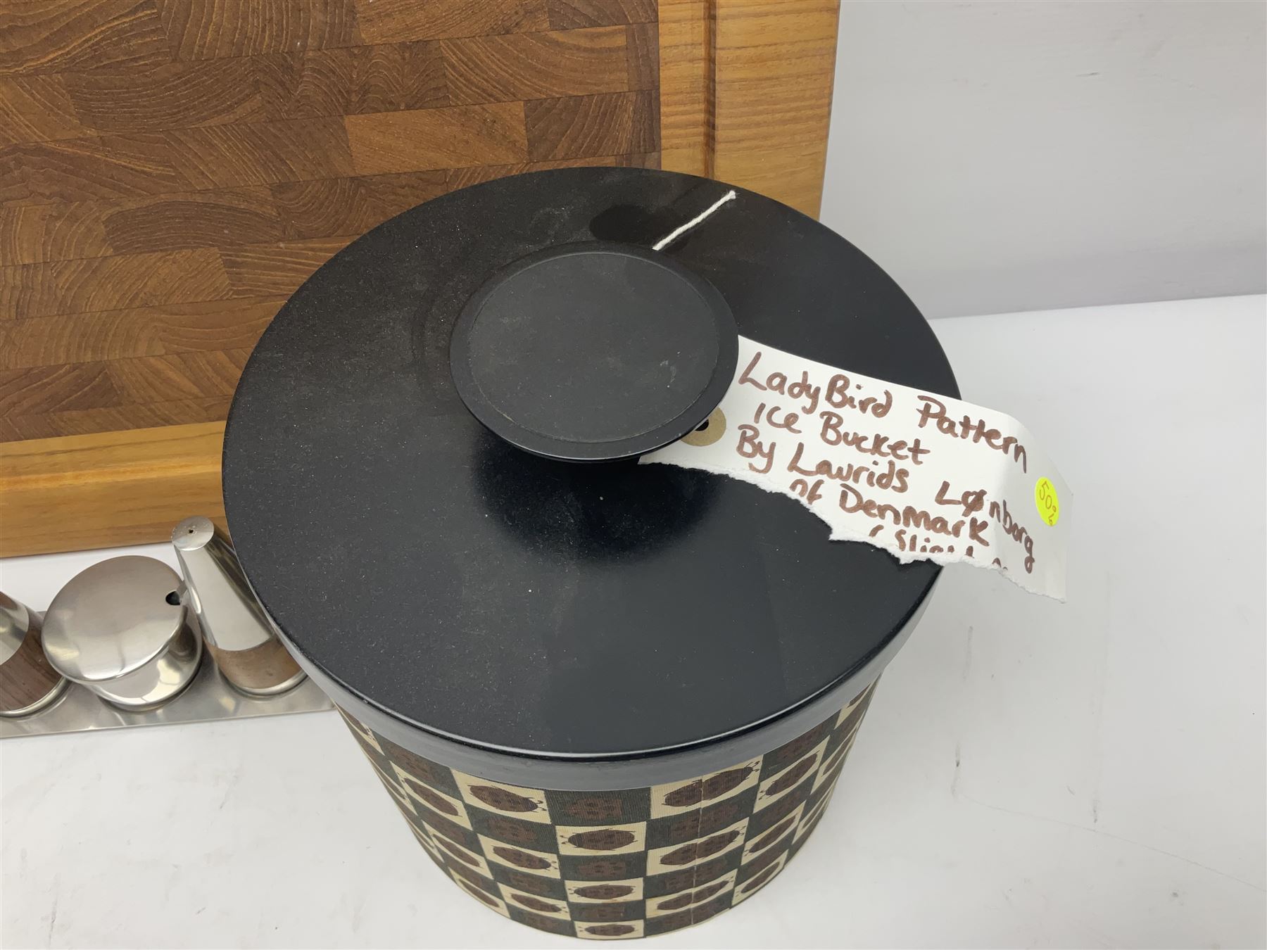 Danish collectables, to include teak tray by Nissen Denmark, ladybird pattern biscuit barrel by Laurids Lonborg and a Stelton stainless steel and wooden cruet set, together with a mid century floral tile trivet