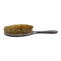 Silver mounted five piece dressing table set, including hand mirror, two hair brushes and two clothes brushes, all hallmarked, together with a silver lidded glass dressing table jar and a silver mounted vase with weighted base