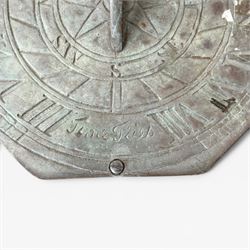 Weathered cast stone sundial, shaped top with metal dial, patterned column