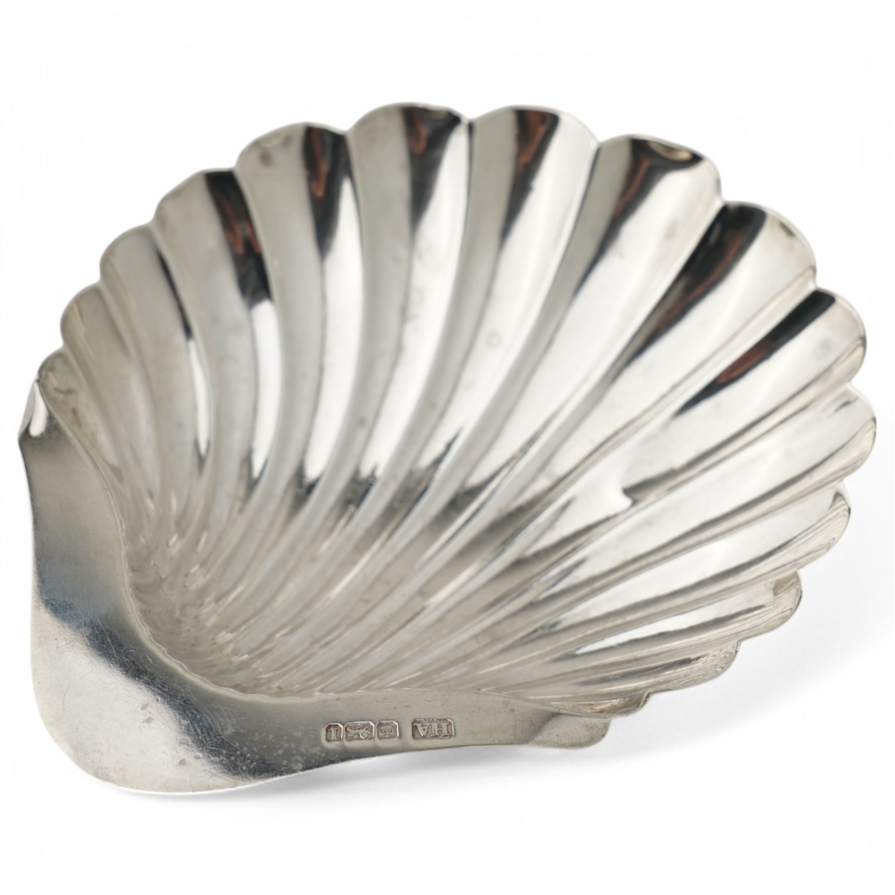 George III silver wine funnel London 1818 Maker William Bateman I, small silver four division toast rack, shell butter dish and two condiments 