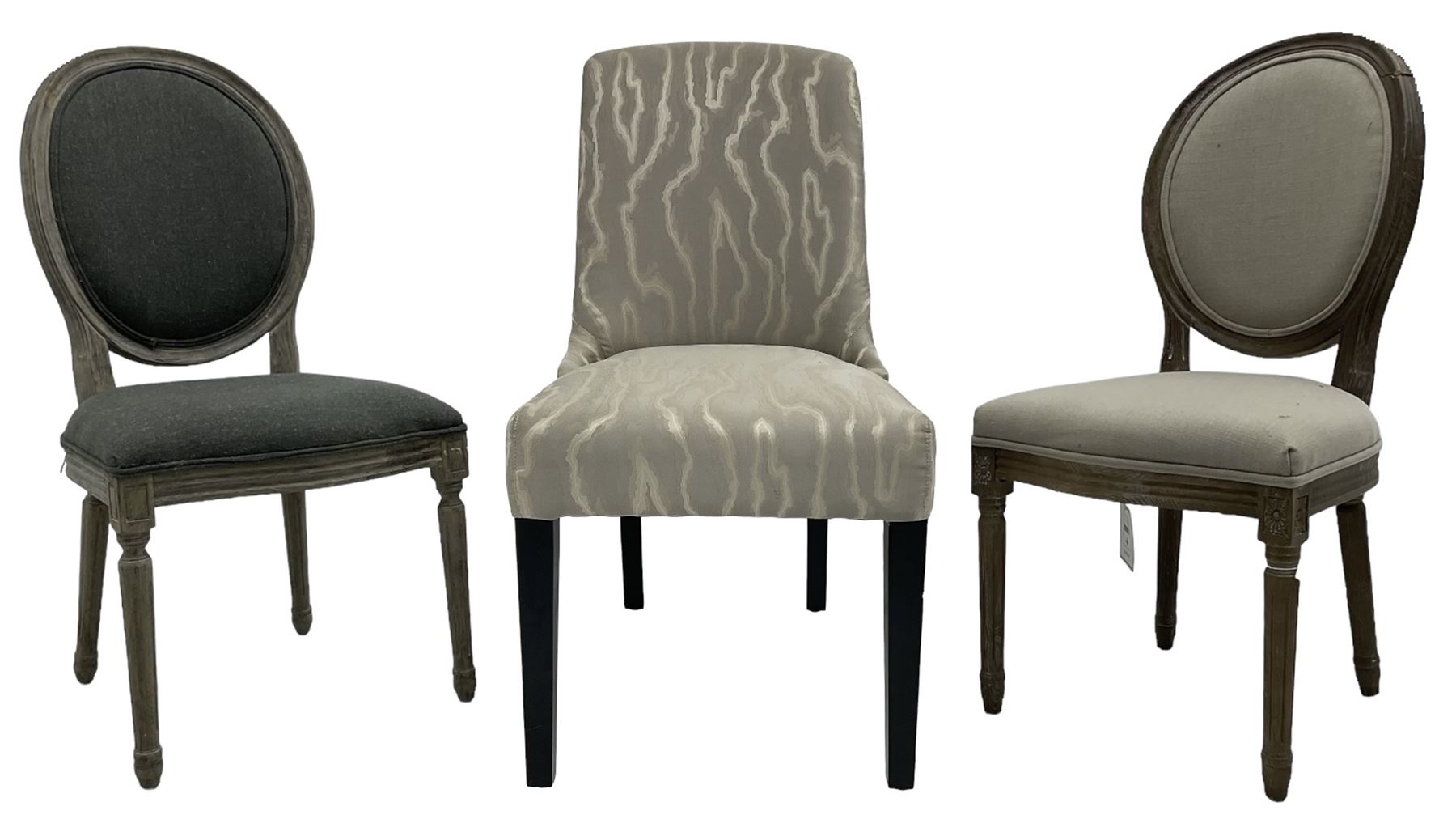 India Jane Interiors - two French design oak side chairs, moulded frame with cameo back, on turned and fluted supports; single side chair with curved back upholstered in shimmer silver fabric, on ebonised supports (3) - ex-display/bankruptcy stock 