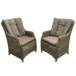 Pair of conservatory rattan armchairs with loose cushions 