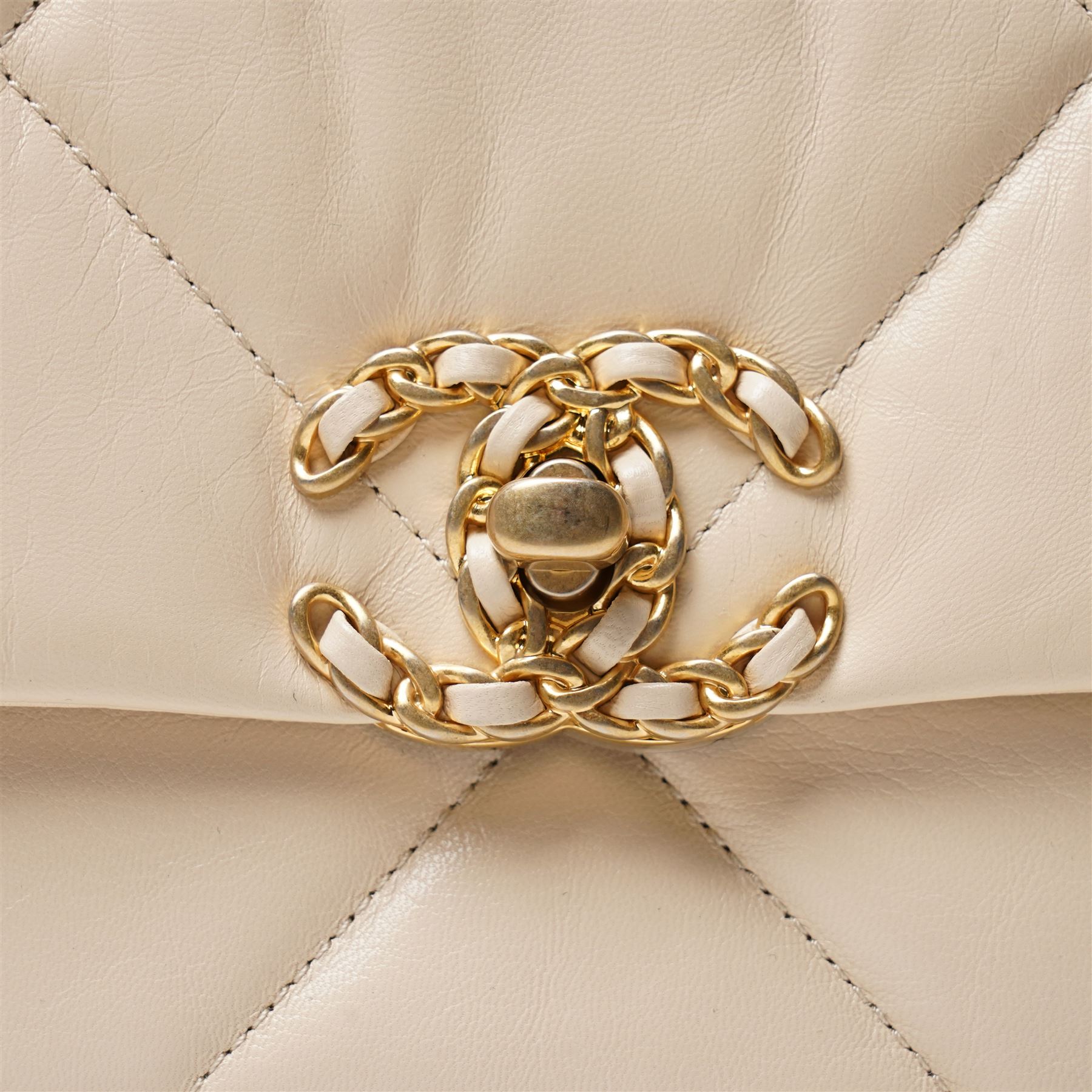 Chanel - ‘19’ Medium Flap Bag, the model introduced in 2019 as one of the final designs associated with Karl Lagerfeld, in cream quilted lambskin leather with mixed gold, silver and ruthenium-tone chain strap and signature CC monogram turn-lock fastening, unused with original dust bag and box