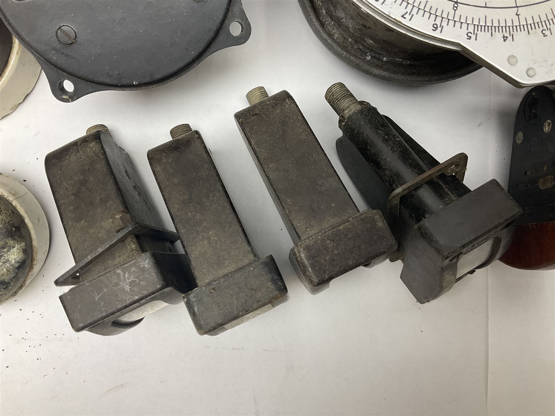 Three RAF light switches, together with military oxygen canister, batteries, gages etc  